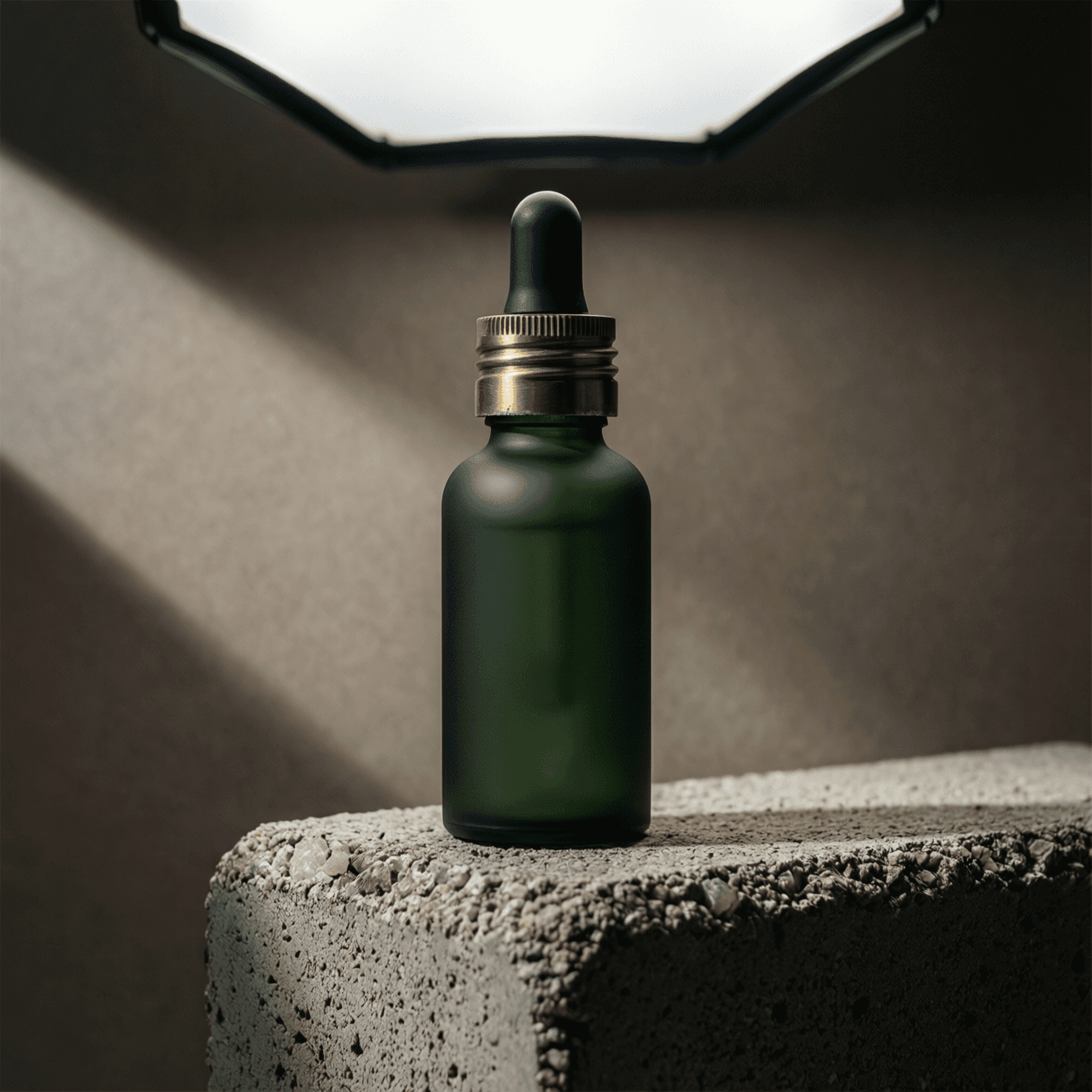 Luxury green dropper bottle on textured stone platform